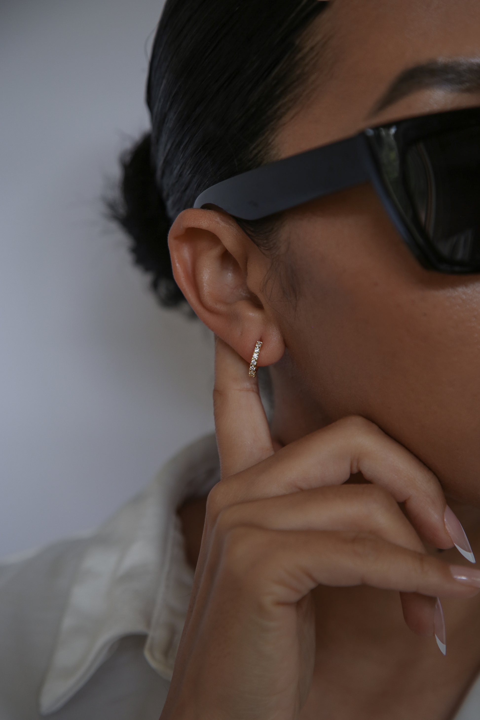 woman wearing 12mm hoop earrings