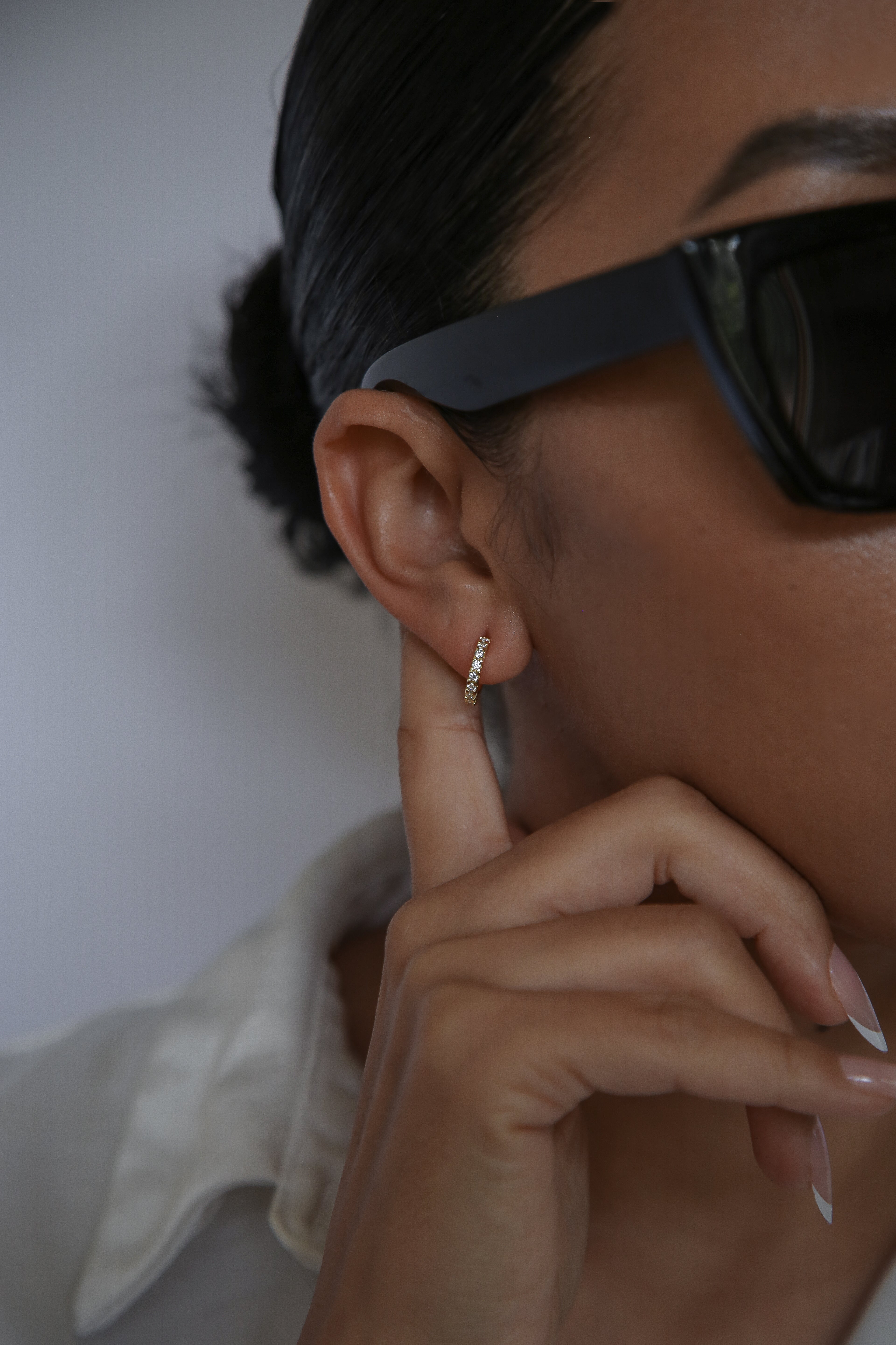 woman wearing 12mm hoop earrings