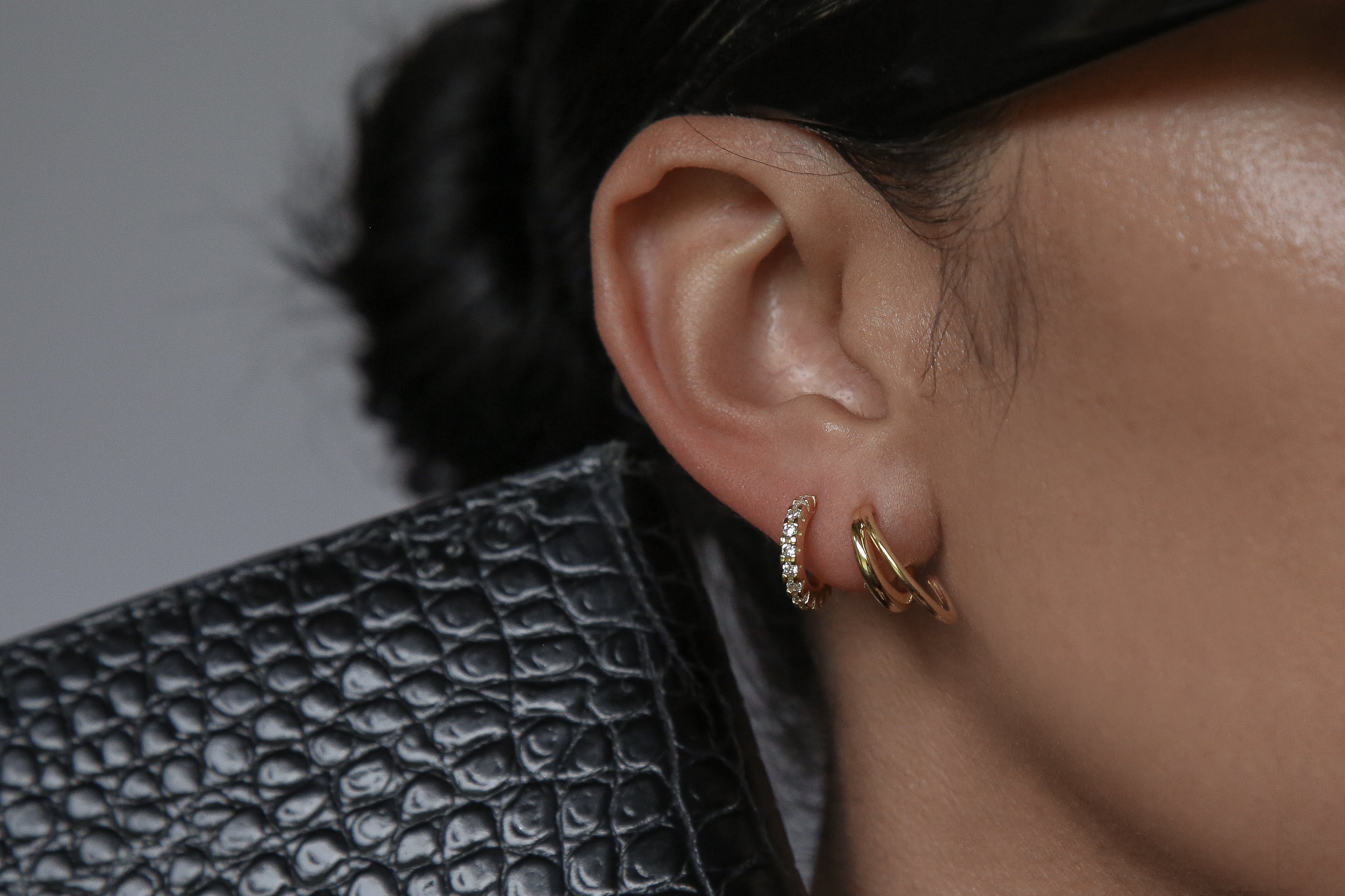 woman wearing 12mm hoop gold earrings
